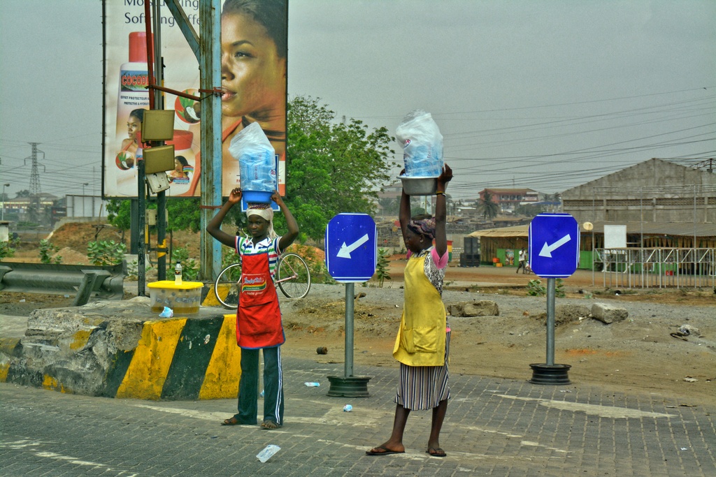 2 young girls selling water on the motorway, 2016 - Accra Tema Motorway